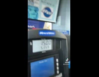 Powerade bottle on screen with squinted face at gas station
