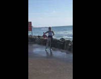 Woman selfie photo shoot ocean waves splash