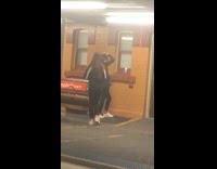 Two women jacket tiktok dance train station