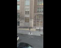 Person on unicycle also juggles down street