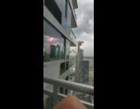 Debris flies into the air from balcony 