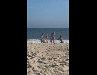 Guy poses skull art painting beach sand
