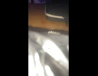 Three girls with large eggplant on table 