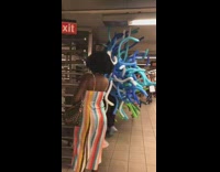 body suit of blue balloons in subway station