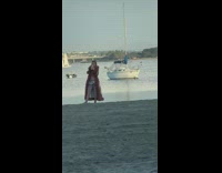 Woman bikini brown fur coat selfie beach