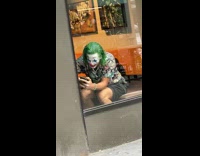 Guy with joker face paint inside starbucks 