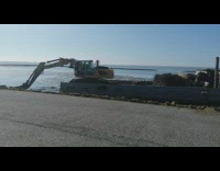 Excavator push mud make schute boat move