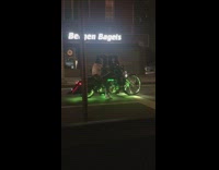Man on motorcycle with green lights
