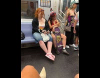 Woman draws tattoo on body using marker