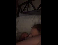 Kid plays harmonica beside mom 