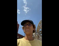 Guy yellow shirt slaps metal statue on the butt 