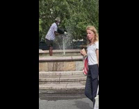 Man washes bag in fountain 