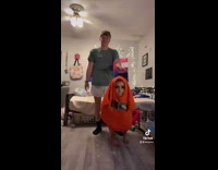 Guy dribbles girl dressed like basketball 