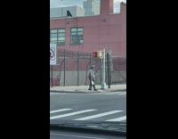 Clown juggles for stopped cars 