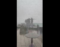 Chair and cushion blown by strong thunderstorm 