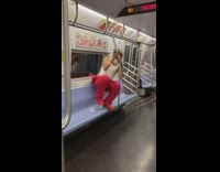Red jumpsuit white shirt guy dances subway 