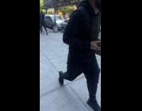 Old lady drives mobility scooter on sidewalk