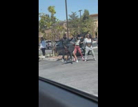 Five people tiktok dance on the parking lot