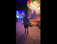 Man weird costume dances inside amusement park