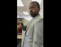 Guy mixes and swirls iced coffee  