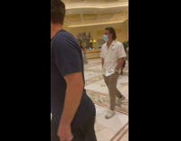 Woman opens coat pose in the Bellagio for photoshoot