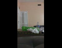 Guy bodyslams a cardboard box in living room and says ouch