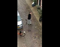 Woman black coat jacket fix hair tripod