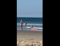 White bikini girl lays fixes wedgie beach 