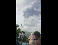 Large volcano eruption smoke combined with the clouds