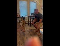 Dog biting ball watch guy do workout