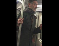 Guy scarves tied around neck court subway 