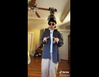 Dog sits on girls shoulders paws on head 