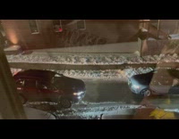Girl watches two drivers argue in street