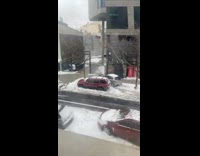 Car drives on sidewalk to avoid snow