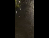 Girl black jacket flood splash car night