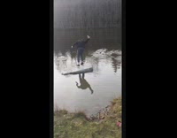 Black sweater guy jumps water rock fail 
