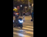 Collab IITW - Woman poses middle street with arc behind