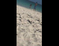 Woman bikini white skirt seaside video shoot