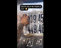 Guy changes number on gas station prices