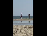 Woman white coat veil photo shoot beach