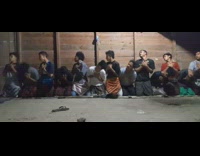 Bunch of guys on knees doing a synchronized routine