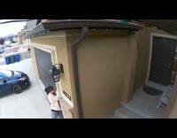 Girl walks into garage door blue car 
