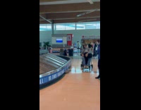 Man jean jacket tiktok dance inside airport