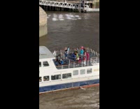 Group of women dance on ferry boat