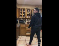 Guy shuts cabinet doors to song 