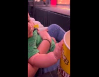 Baby spills popcorn to dad watching play