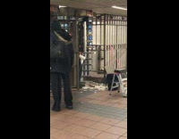 MTA worker pulls hundreds of used metro cards passes from ceiling above turnstile exit