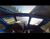 Guy drives boat through rough river water