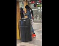 Woman gets haircut at station 