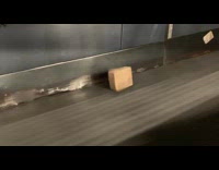 Box rolls on conveyor belt at work